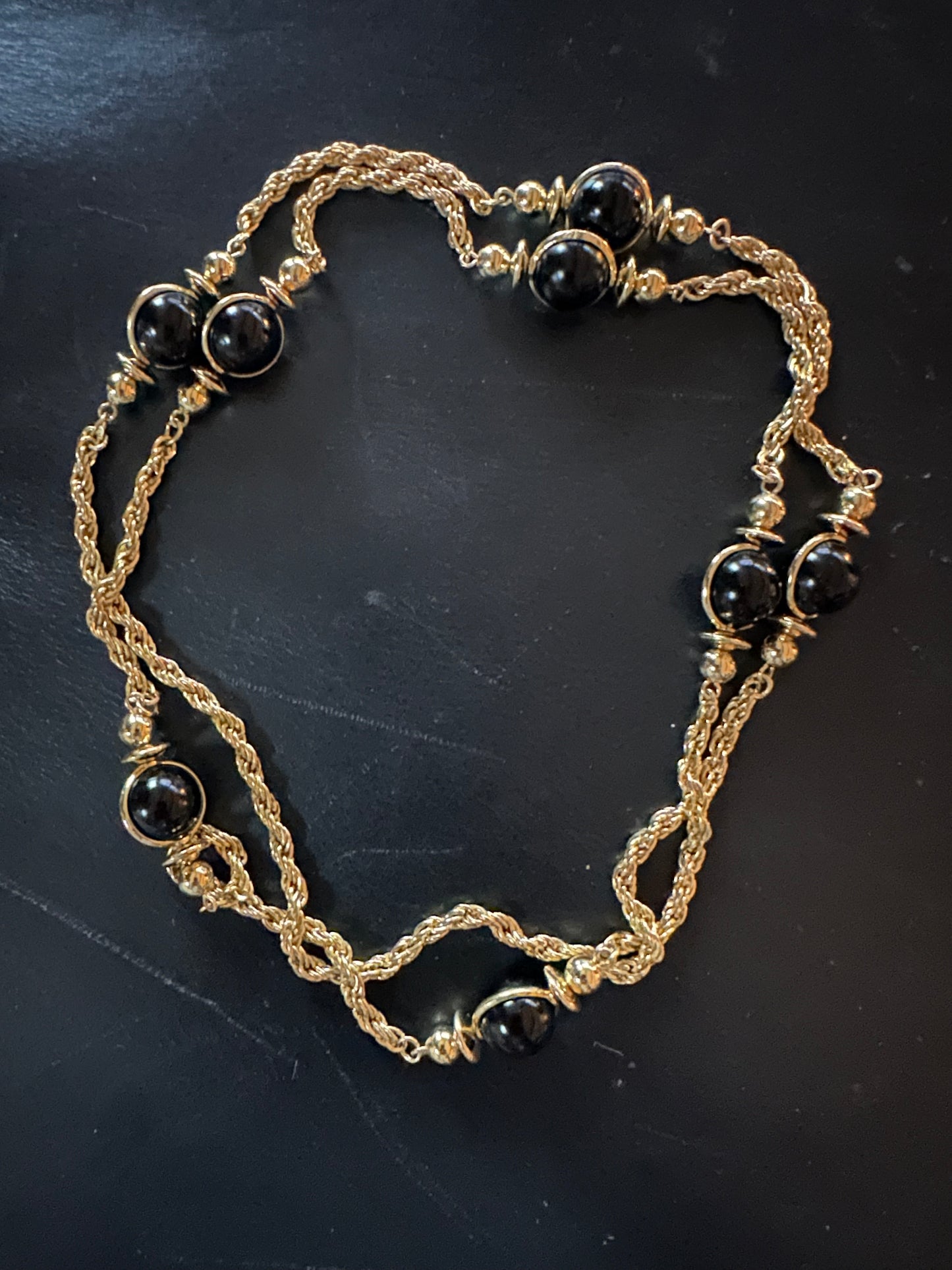 Long gold tone necklace with beads