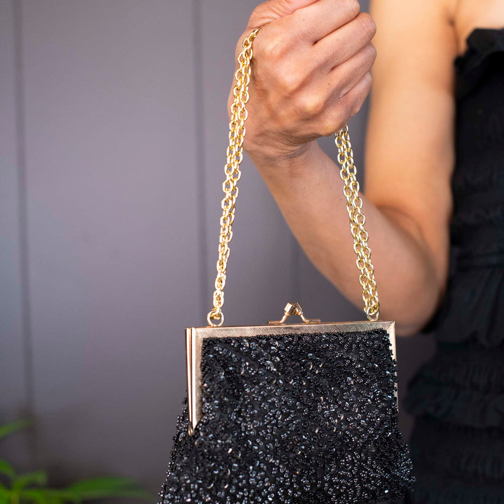 
                      
                        Vintage Magic black seed beaded evening purse
                      
                    