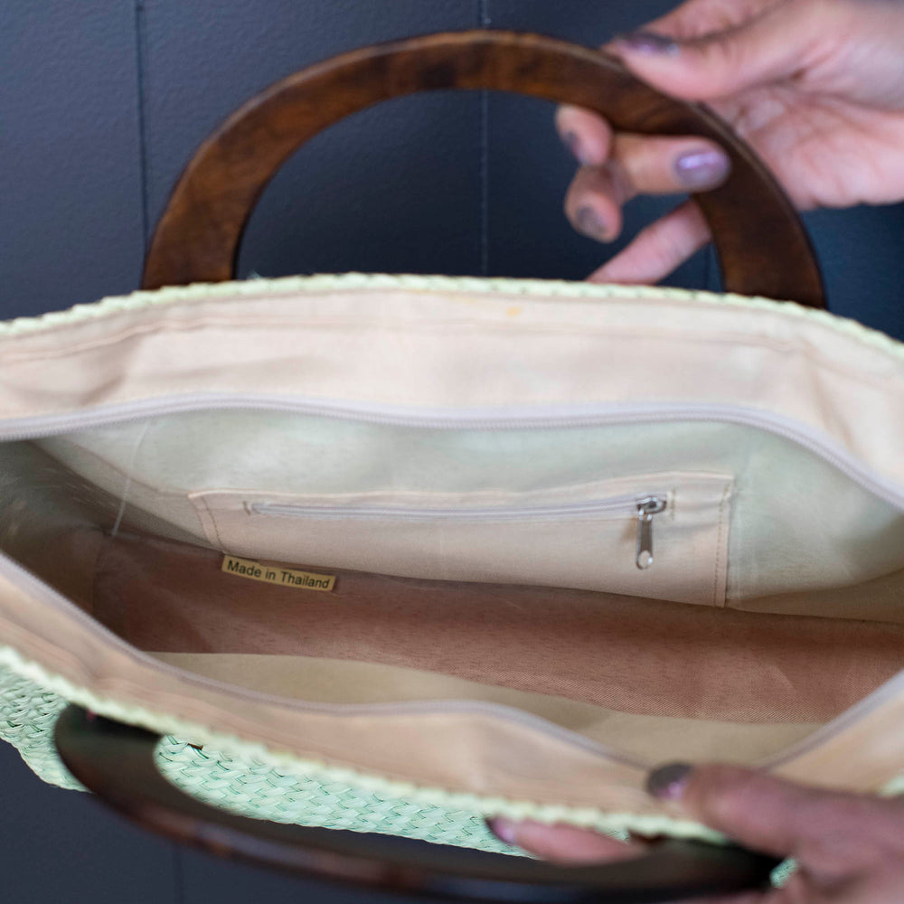 
                      
                        Vintage Handwoven Straw Tote Bag with Wooden Handles
                      
                    