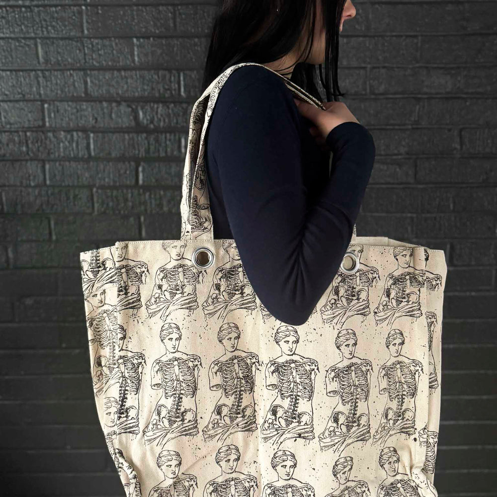 
                      
                        Grungy Grommet Tote
                      
                    