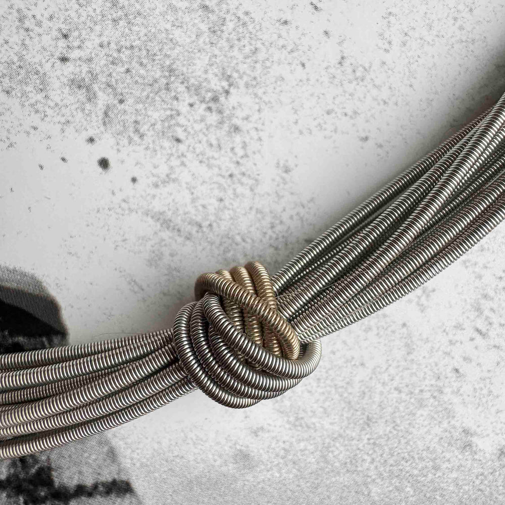 
                      
                        Pre-Loved Recycled Piano Wire Necklace – Sustainable Chic
                      
                    