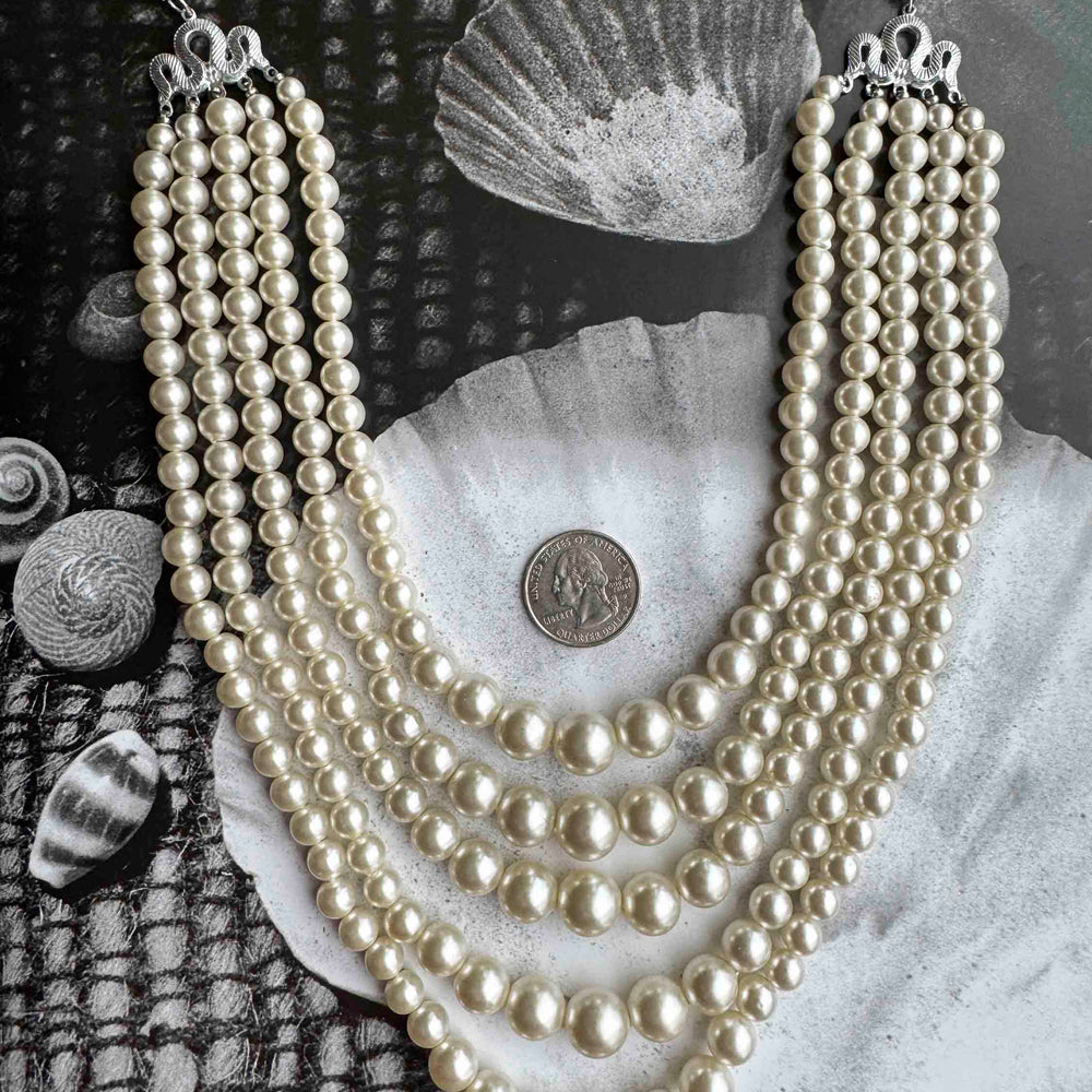 
                      
                        Vintage Multi-Strand Pearl Necklace – Classic Hollywood Glam
                      
                    