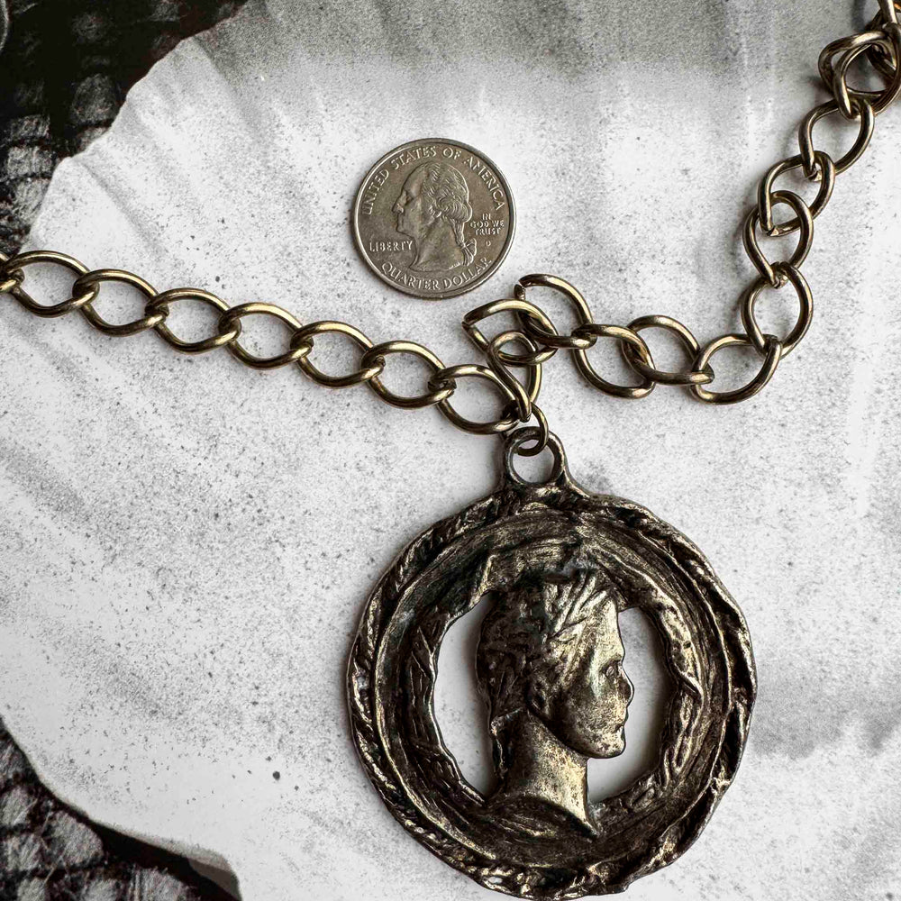 
                      
                        Vintage Bronze Coin Pendant Necklace – Aged Elegance
                      
                    