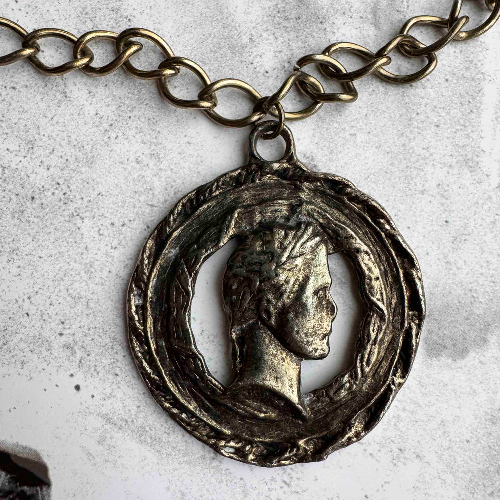 
                      
                        Vintage Bronze Coin Pendant Necklace – Aged Elegance
                      
                    