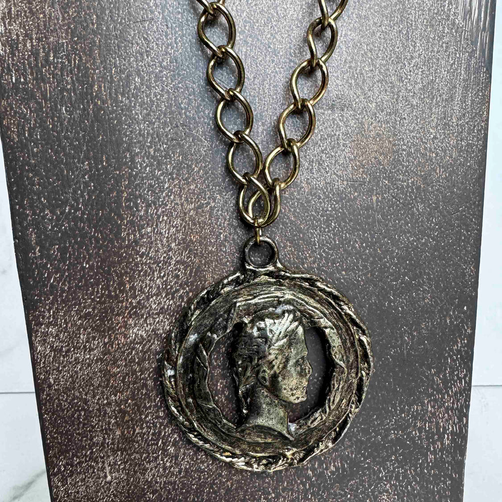 
                      
                        Vintage Bronze Coin Pendant Necklace – Aged Elegance
                      
                    